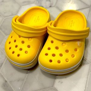 Bright yellow baby crocs size 4